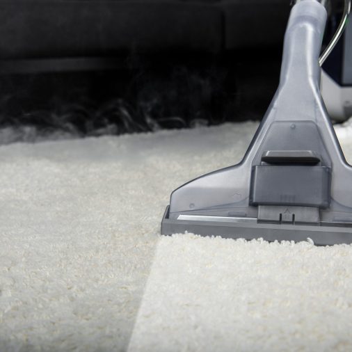 close-up-view-of-person-cleaning-white-carpet-with-2021-08-29-22-35-53-utc